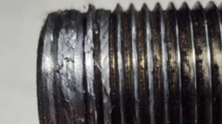 Example of male thread damage caused by the use of a power tool.