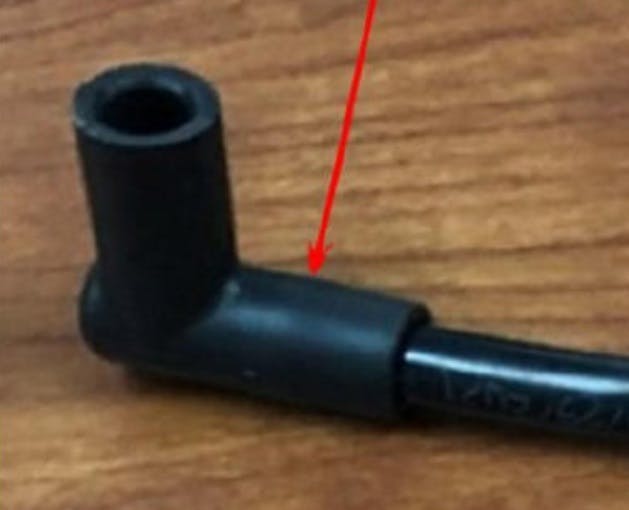 Example of the tube pushed too far into the elbow. Note that the bead on the tube is not visible.