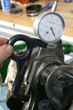 Once the bolt is torqued to spec, the gauge is then placed onto the bolt to reveal how much the bolt has stretched. Rod bolts need to stretch by a few thousandths of an inch in order to achieve clamping load. The spec card supplied with the rods will provide the maximum allowable stretch. If excessively torqued, the bolt may stretch too far, losing its elastic properties. Once the bolt is torqued to spec, the gauge is then placed onto the bolt to reveal how much the bolt has stretched. Rod bolts need to stretch by a few thousandths of an inch in order to achieve clamping load. The spec card supplied with the rods will provide the maximum allowable stretch. If excessively torqued, the bolt may stretch too far, losing its elastic properties.
