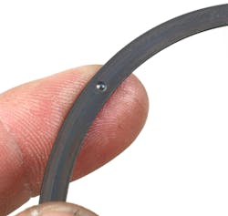 If the pin bore does encroach into the oil ring groove, a separate support rail must be installed at the bottom land of the oil ring groove before the oil ring package is installed. This provides a complete footprint for the oil ring. The support rail will feature a small male bump. When the support rail is installed, this bump must face downward and located at the top of the pin bore where the bore enters the ring groove. If the pin bore does encroach into the oil ring groove, a separate support rail must be installed at the bottom land of the oil ring groove before the oil ring package is installed. This provides a complete footprint for the oil ring. The support rail will feature a small male bump. When the support rail is installed, this bump must face downward and located at the top of the pin bore where the bore enters the ring groove.