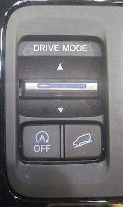 This Start-Stop OFF button, located beside the Drive Mode selector, allows the driver to manually disable the Start-Stop system. Once pressed, the system will not shut off the engine at idle until the vehicle is restarted or the button is pressed again. This Start-Stop OFF button, located beside the Drive Mode selector, allows the driver to manually disable the Start-Stop system. Once pressed, the system will not shut off the engine at idle until the vehicle is restarted or the button is pressed again.