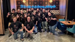 The team and their spouses all rocking t-shirts with Chuck's face printed on them. The team and their spouses all rocking t-shirts with Chuck's face printed on them.