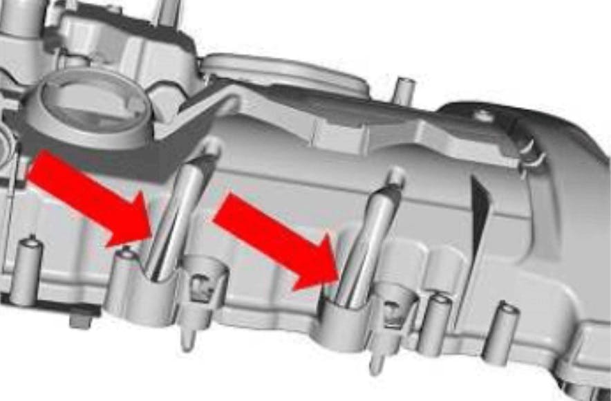 The updated cover features additional supports on the crankcase ventilation ports.