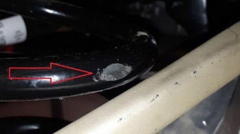 Example of run mark on a rear coil spring.