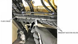 Use a trim tool to release the cable from the plastic bracket. Use a trim tool to release the cable from the plastic bracket.