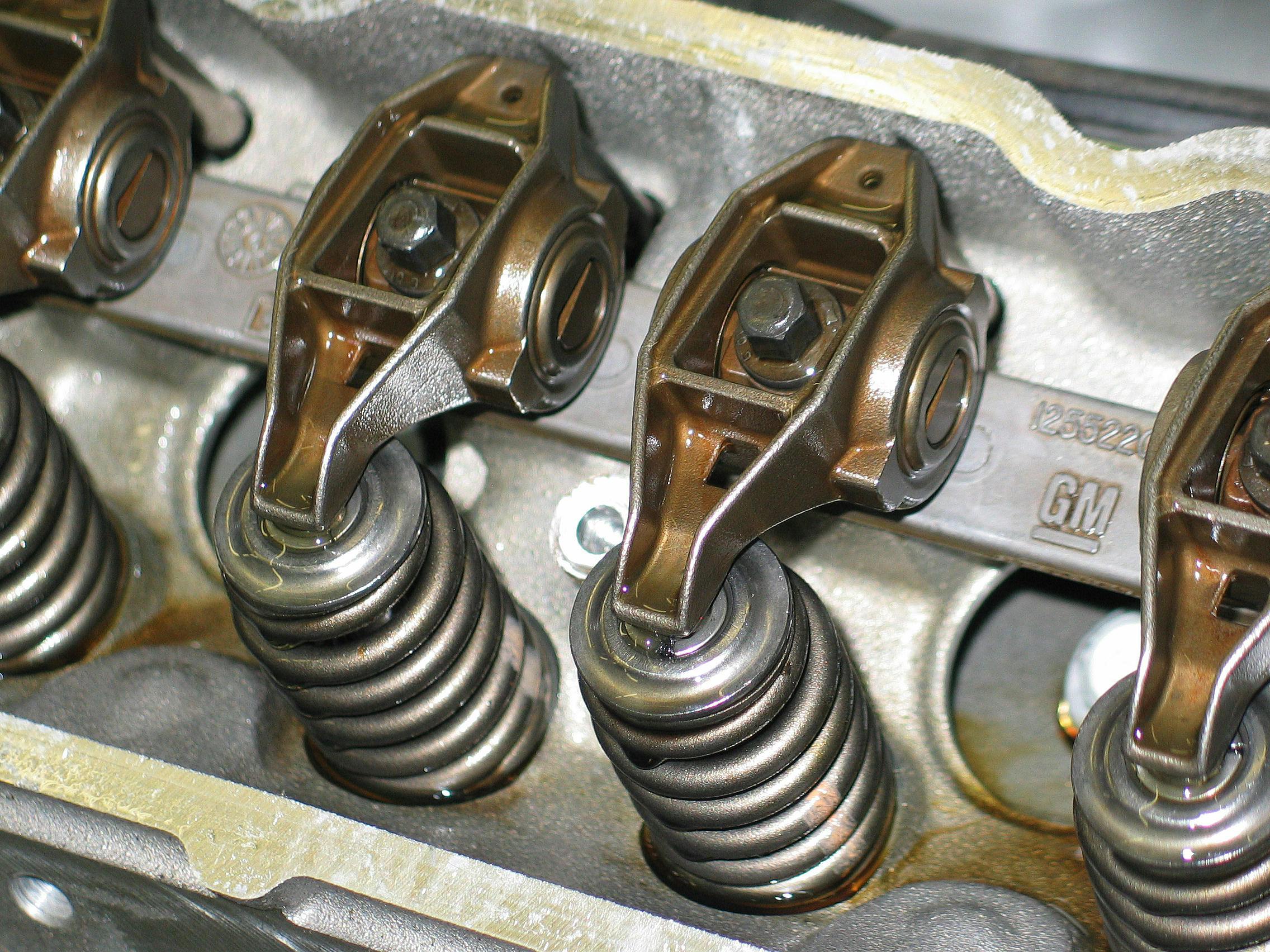 As pressurized oil is forced into the engine, you will hear a gurgle noise as the oil begins to displace air. Continue pressurizing the system until you verify that oil is being delivered to the rockers.