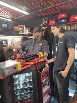 Robert Robinson Interacts With A Customer Robert Robinson Interacts With A Customer