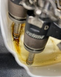 Honda GDI injectors soaking in cleaner solution. Even with extended soaking, baked-on carbon at the nozzle tip is rarely dissolved. Most deposits require injector replacement to restore proper spray pattern and fuel delivery. Honda GDI injectors soaking in cleaner solution. Even with extended soaking, baked-on carbon at the nozzle tip is rarely dissolved. Most deposits require injector replacement to restore proper spray pattern and fuel delivery.