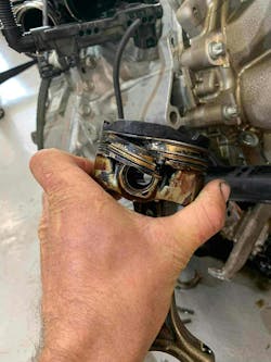 This is a classic example of LSPI damage, where the piston breaks below the compression ring just above the wrist pin. This example is from a BMW B48, common across the BMW/Mini lineup. Its use of GDI and twin-scroll turbocharger makes it a popular engine platform. This is a classic example of LSPI damage, where the piston breaks below the compression ring just above the wrist pin. This example is from a BMW B48, common across the BMW/Mini lineup. Its use of GDI and twin-scroll turbocharger makes it a popular engine platform.