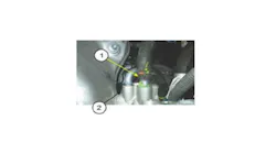 Dried coolant at the water pipe (1) is normal and does not require part replacement.