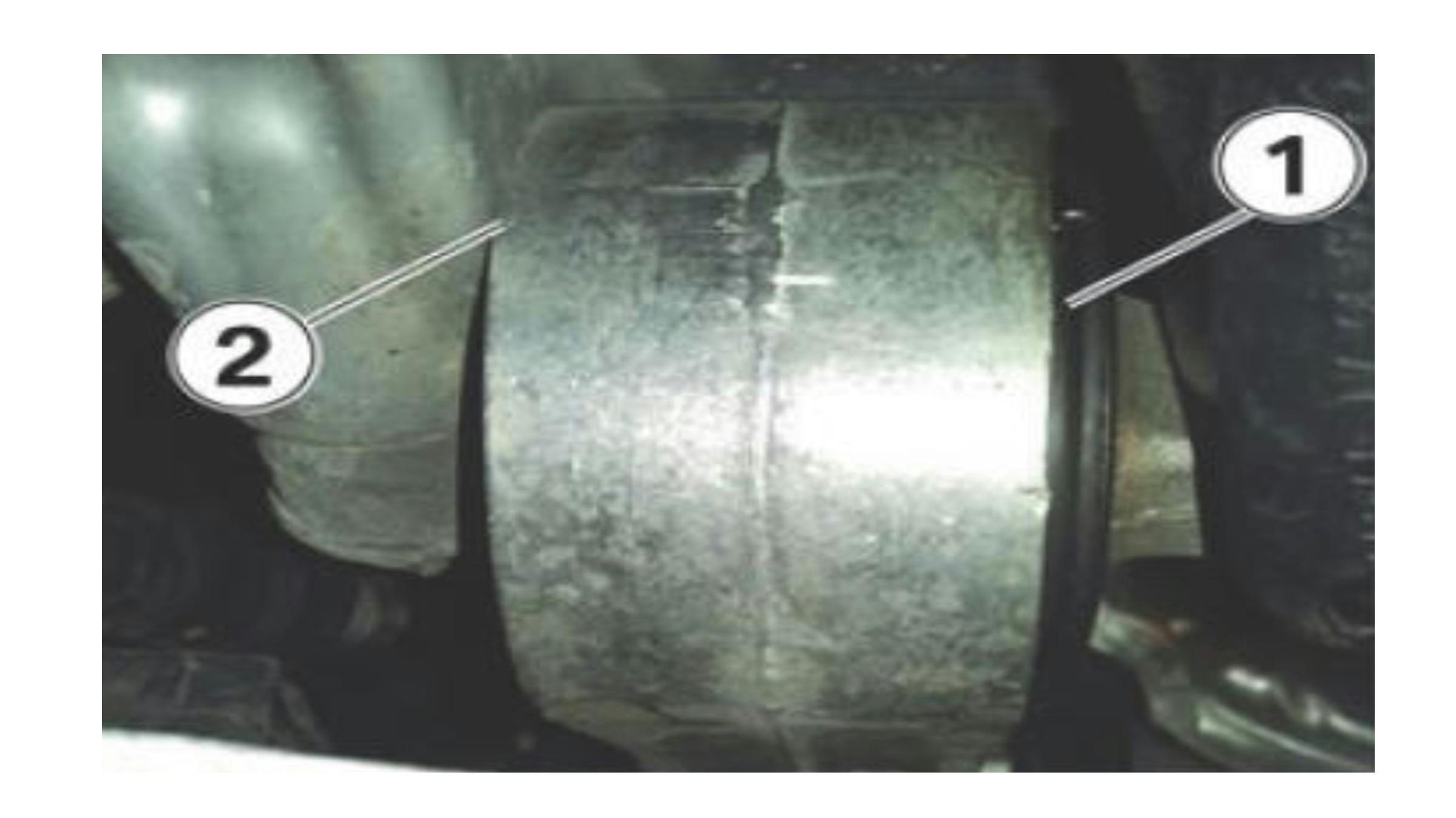 If the stabilizer link&rsquo;s bushing begins to walk out (1), the housing can rub against the oil pan (2).