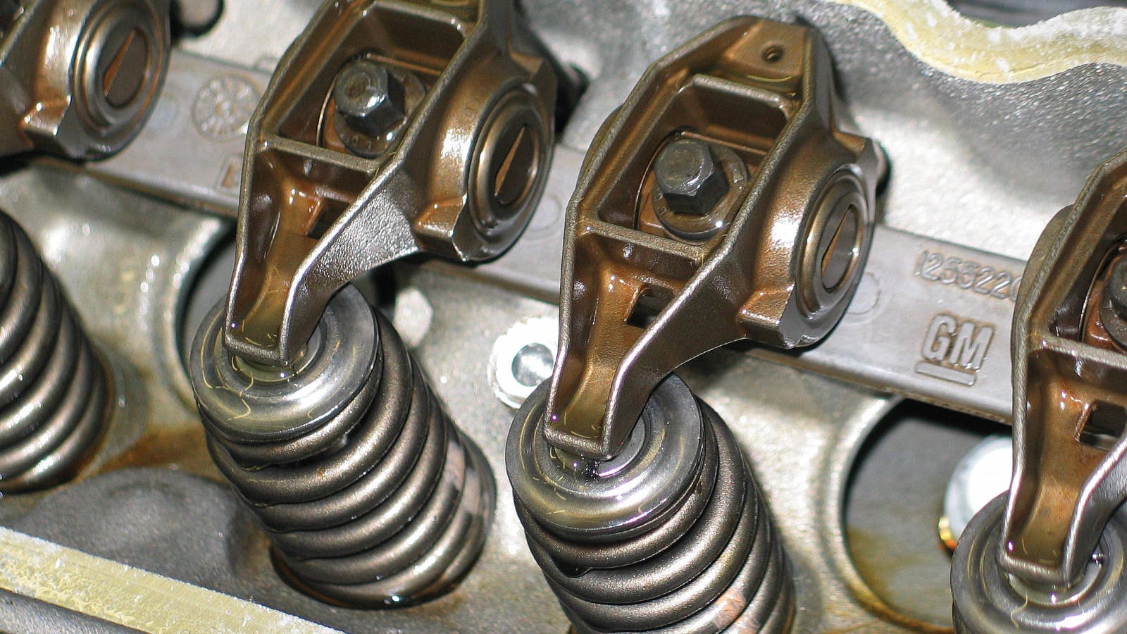 As pressurized oil is forced into the engine, you will hear a gurgle noise as the oil begins to displace air. Continue pressurizing the system until you verify that oil is being delivered to the rockers.