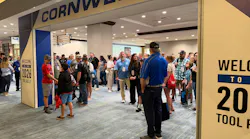 Crowds line up at the entrance to the Cornwell Quality Tools National Rally, marking the start of the event as distributors and attendees make their way inside.