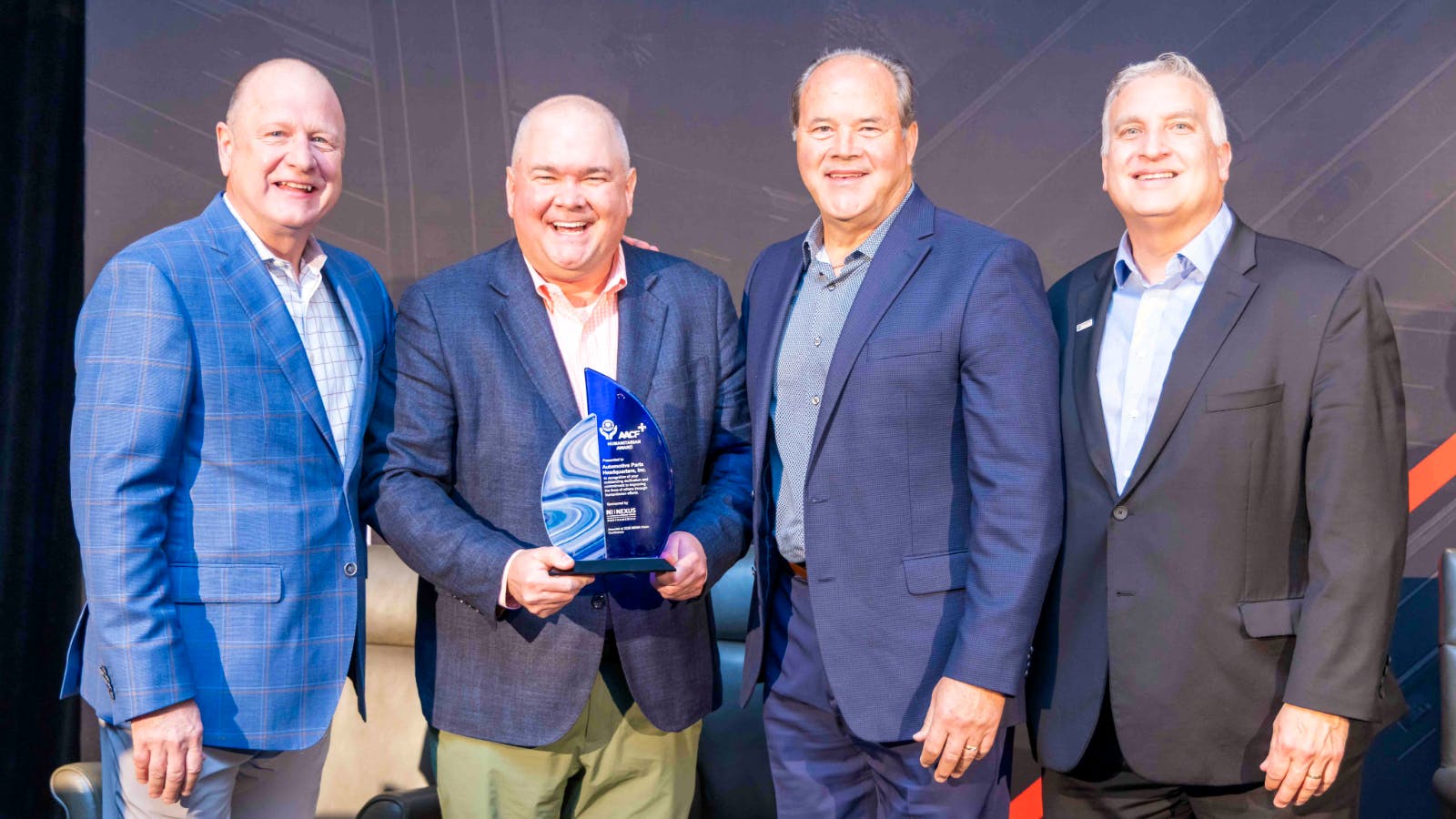 The AACF Humanitarian Award was presented on stage to Corey Bartlett, President & CEO on behalf of APH by Jon Owens, AACF President, alongside Joe Stephen of NEXUS North America, and John Kairys, AACF Executive Director.
