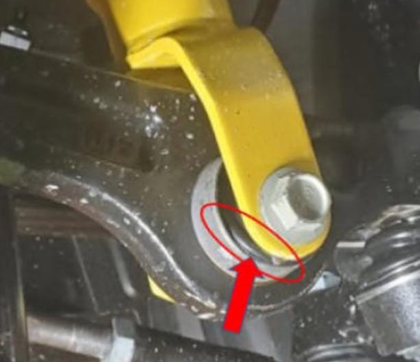 Example of under-cured bushing. Notice the rubber bulging out at the lower area.