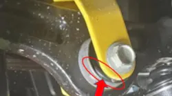 Example of under-cured bushing. Notice the rubber bulging out at the lower area.