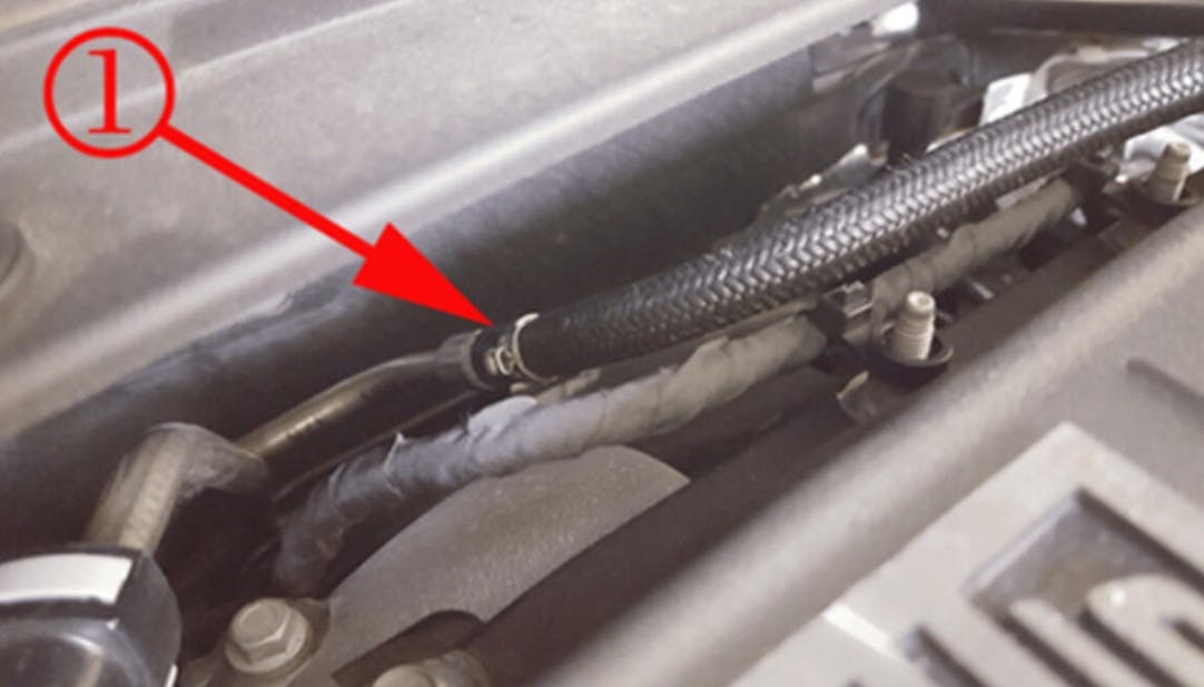 This example shows the location of the fuel feed pipe on the LT4 engine. This line runs along the firewall and below. It will have a jumper line with quick disconnects at both ends. One end will connect to the chassis line and the other end to the high pressure pump feed line.