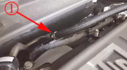 This example shows the location of the fuel feed pipe on the LT4 engine. This line runs along the firewall and below. It will have a jumper line with quick disconnects at both ends. One end will connect to the chassis line and the other end to the high pressure pump feed line.
