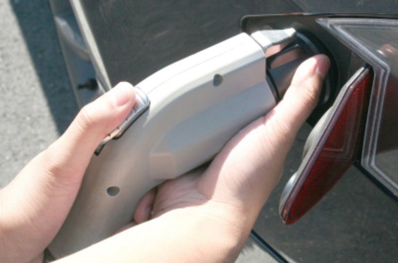 Remove the charging handle and Tesla adapter at the same time.