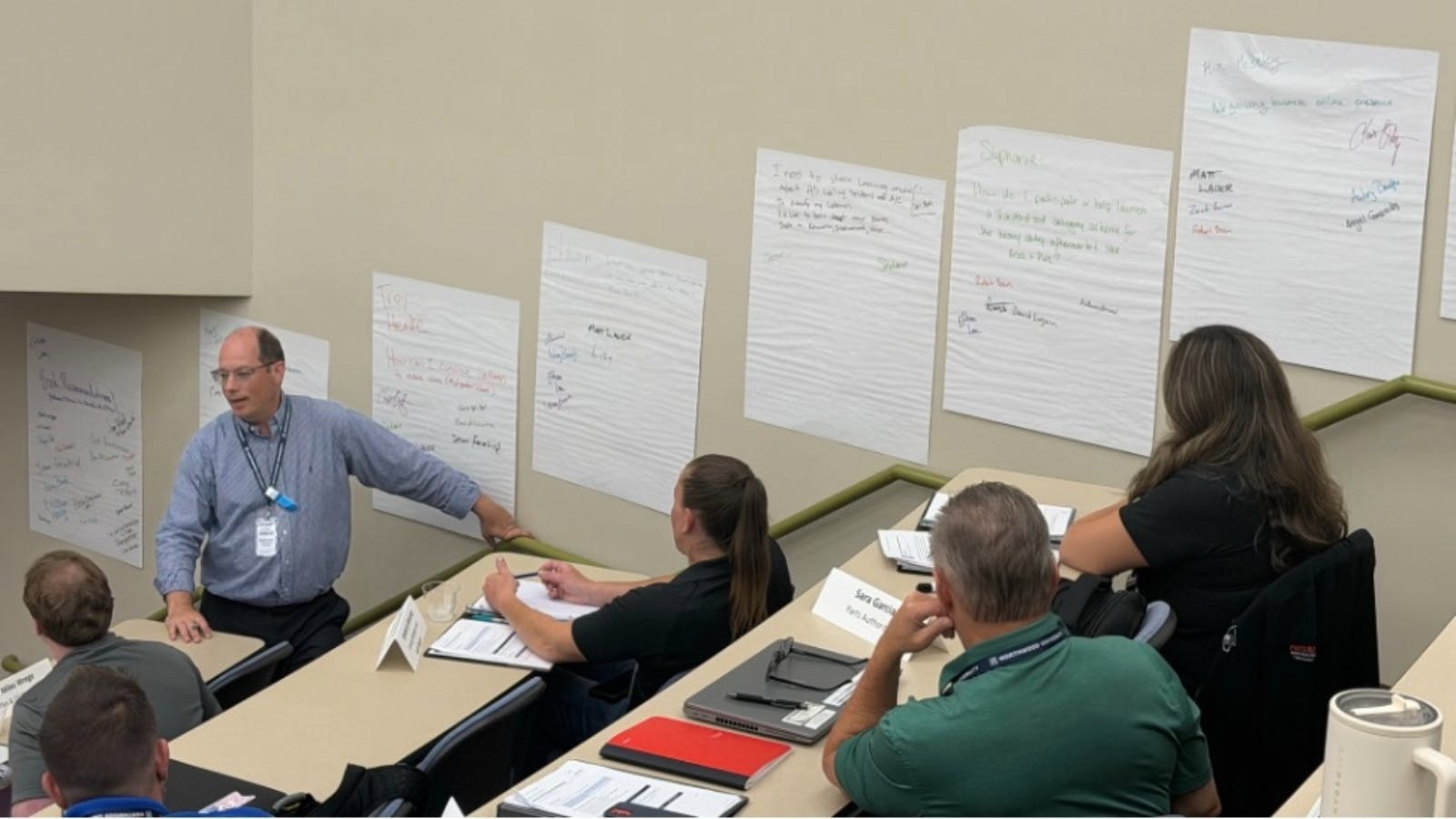 Participants posted personal and professional challenges around the room during a networking and problem-solving exercise.
