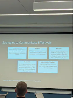 A communication strategy slide emphasized knowing the audience, preparing, being clear, being present, and seeking regular feedback.