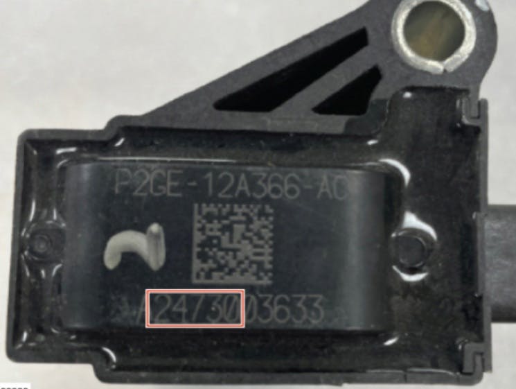 The date code on this example coil is 24730 (July 30, 2024). Each ignition coil has an 11-character alphanumeric manufacture code printed on top. The second through sixth characters of the manufacture code are the date code.