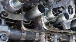 This Ford 5.0L V8 uses variable displacement. Looking closely, the zero-lash springs can be seen on the cam followers; they maintain contact when the rocker freewheels and the cylinder is deactivated.