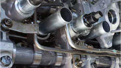 This Ford 5.0L V8 uses variable displacement. Looking closely, the zero-lash springs can be seen on the cam followers; they maintain contact when the rocker freewheels and the cylinder is deactivated.