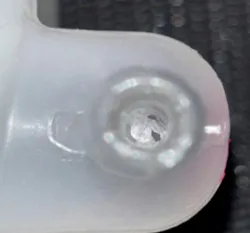 Example of the base of a nipple partially clogged by excess casting material.