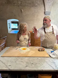 CHEF’S KISS: Cooking is a passion and lesser-known talent of Sue Godschalk, who is seen here taking instruction from a chef in Italy.