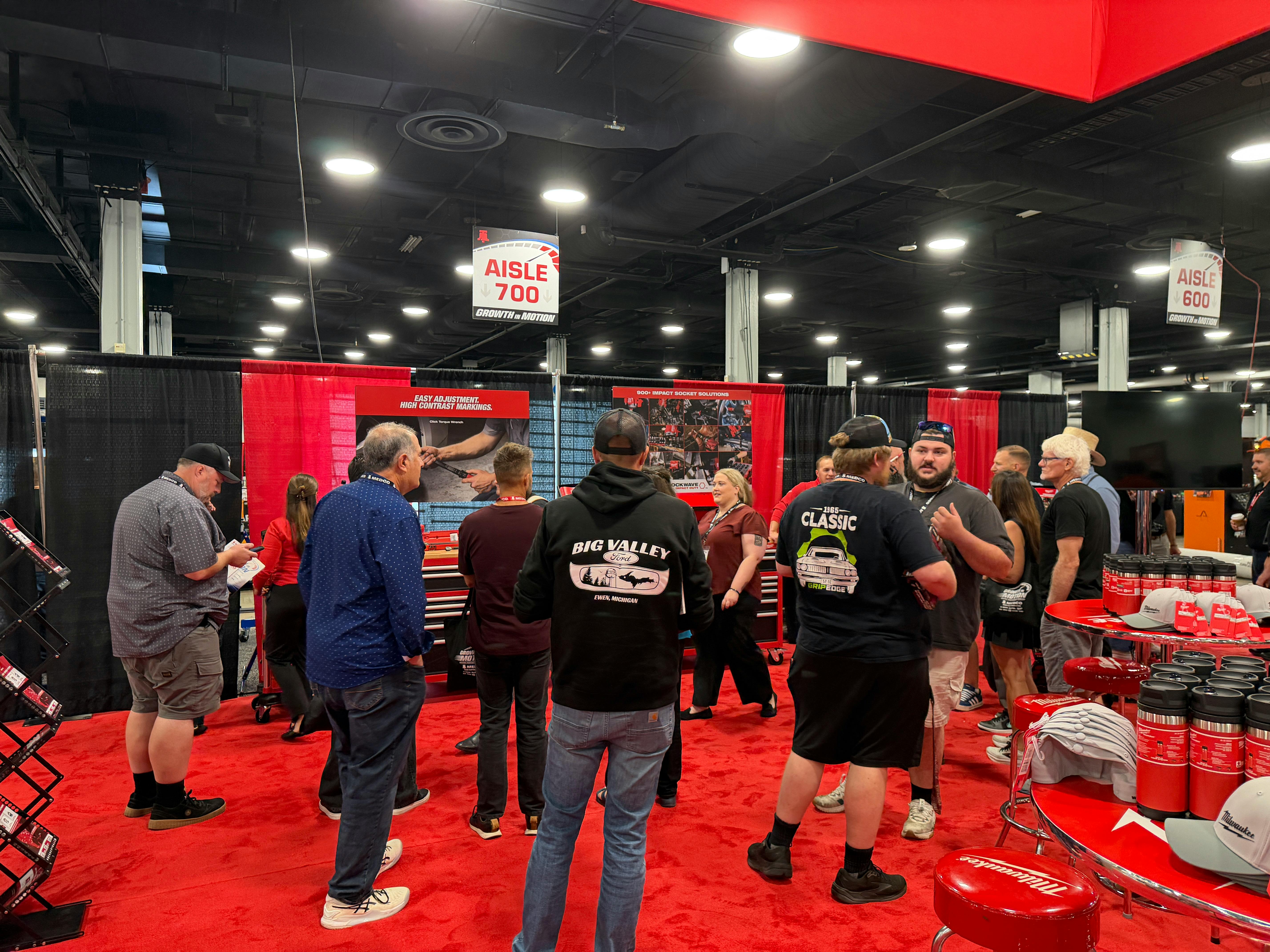 Attendees gather in the Milwaukee Tool booth at the MEDCO customer show for hands on tool demonstrations.