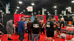 Attendees gather in the Milwaukee Tool booth at the MEDCO customer show for hands on tool demonstrations.