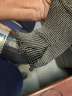 Example of damaged/split abrasion sleeve, which may be a sign that the charge air hose has swelled.