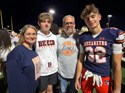 WAREHOUSE TO FIELDHOUSE: Bradley Jackson, with wife Ashley and sons Carter and Miles, says there are only two places to find him: at work or on the football field with his boys.